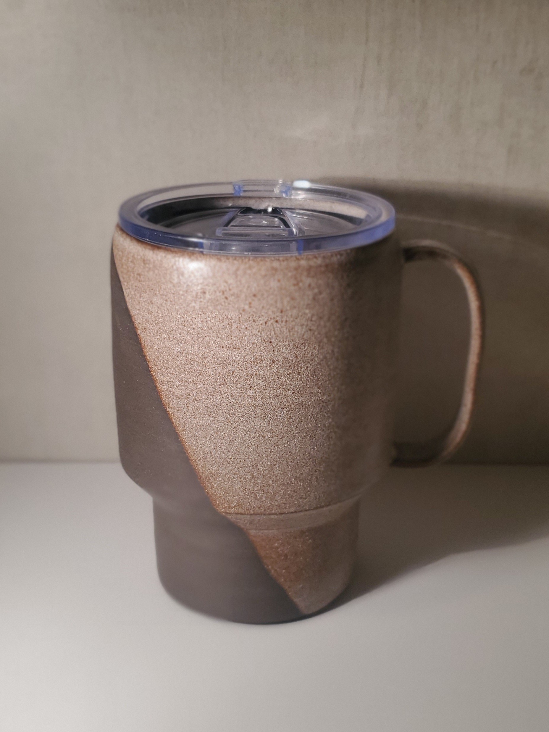 handmade-ceramic-travel-mug-with-locking-lid-dark-colored-pottery-with-earthy-glaze